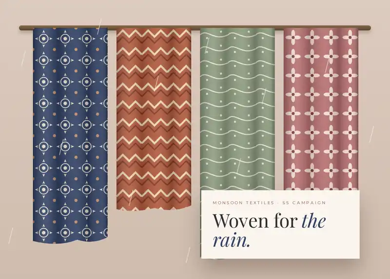 Four patterned Monsoon Textiles fabrics hanging in the rain with a campaign card